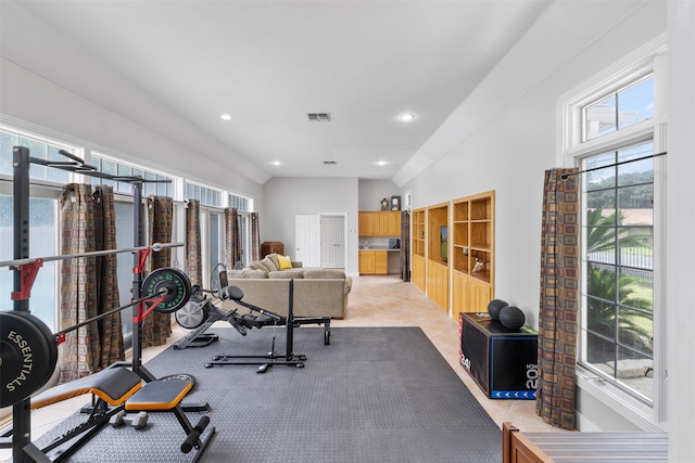 workout room featuring light tile patterned floors