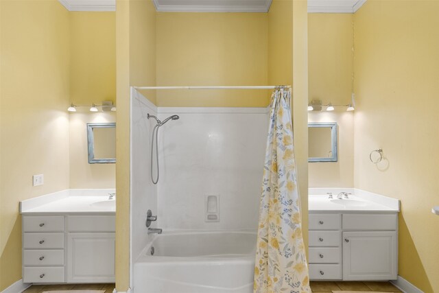 bathroom featuring shower / tub combo with curtain, crown molding, and vanity