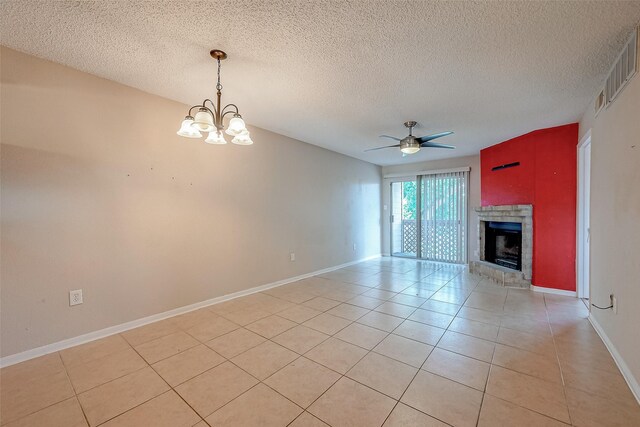1505 Ward Rd Unit 214, Baytown, TX 77520 - unfurnished living room featuring a fireplace with raised hearth, baseboards, light tile patterned floors, ceiling fan with notable chandelier, and visible vents