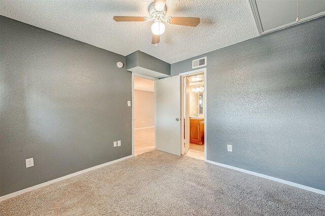 1505 Ward Rd Unit 214, Baytown, TX 77520 - unfurnished bedroom with a textured wall, a textured ceiling, visible vents, and carpet