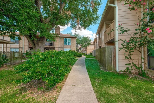 1505 Ward Rd Unit 214, Baytown, TX 77520 - view of community featuring fence and a yard