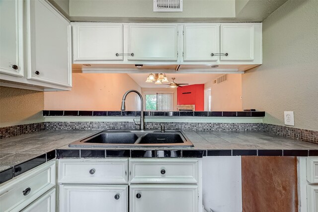 1505 Ward Rd Unit 214, Baytown, TX 77520 - kitchen with white cabinetry, a sink, and visible vents