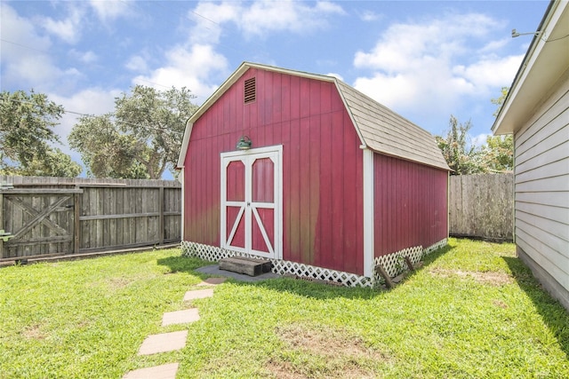 view of outbuilding with a lawn