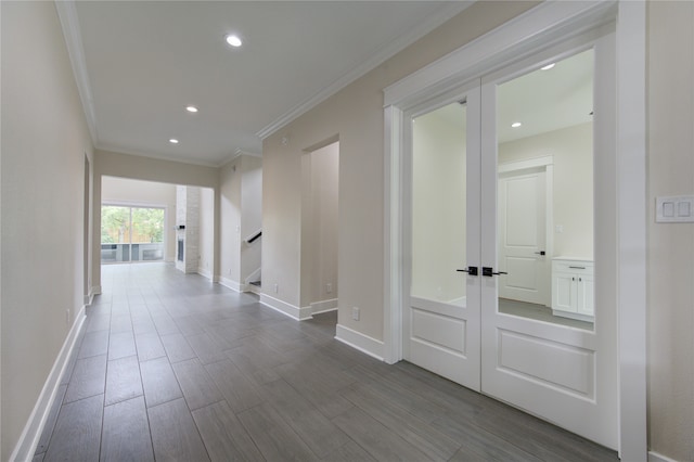 hall with crown molding, french doors, and hardwood / wood-style flooring