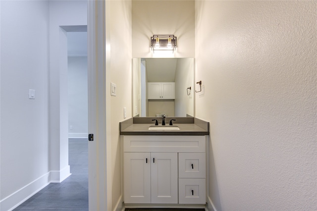 bathroom with vanity and hardwood / wood-style floors