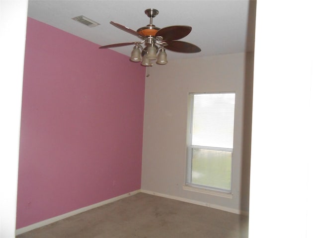 carpeted empty room featuring ceiling fan