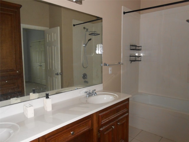 bathroom featuring tile patterned floors, vanity, and bathing tub / shower combination