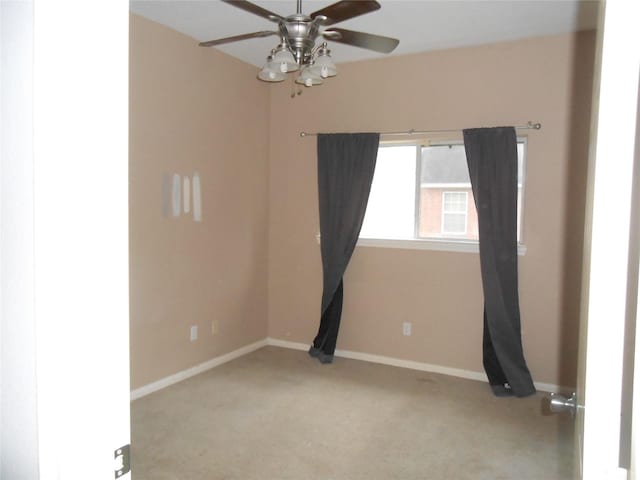 carpeted empty room with ceiling fan