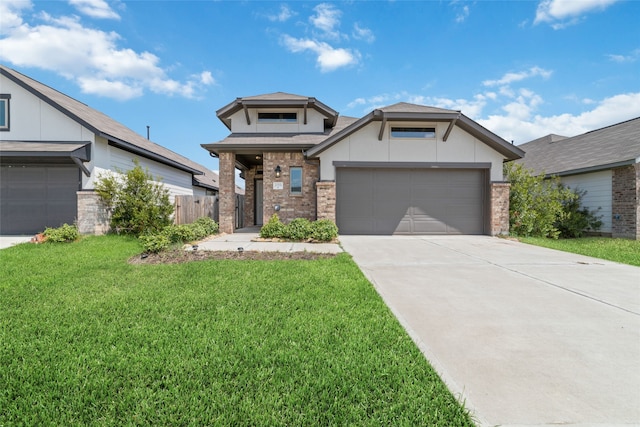 view of front of home featuring a garage and a front yard