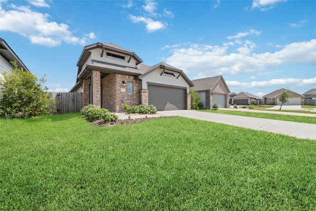 view of front of home with a garage and a front lawn