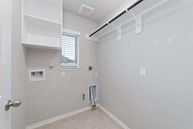 laundry room with washer hookup, light tile patterned floors, hookup for an electric dryer, and hookup for a gas dryer