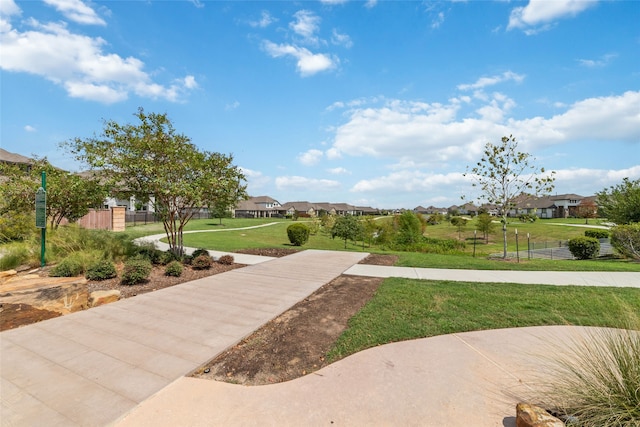 view of property's community featuring a lawn