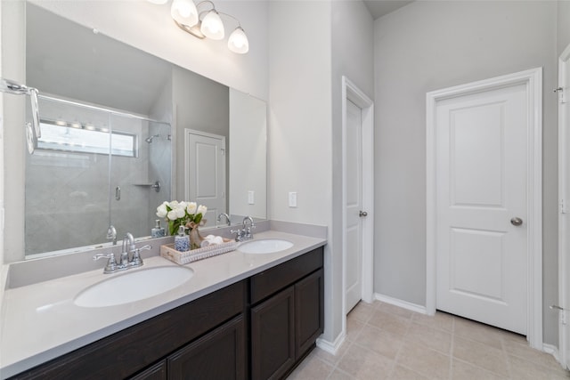 bathroom featuring vanity, walk in shower, and tile patterned floors