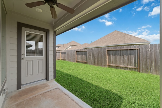 view of yard with ceiling fan