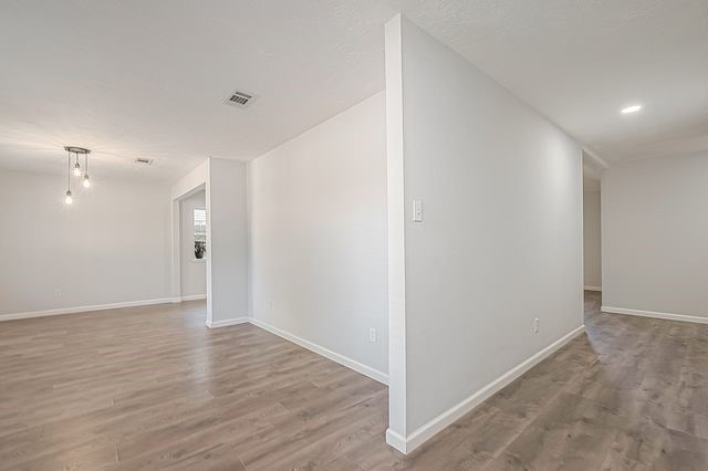 empty room with light hardwood / wood-style floors