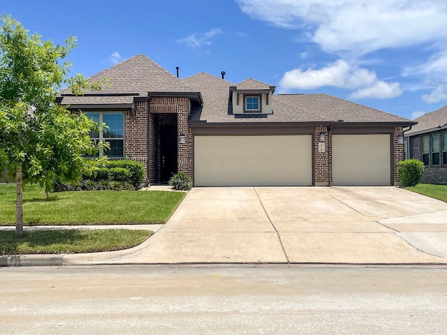 view of front facade featuring a garage and a front lawn