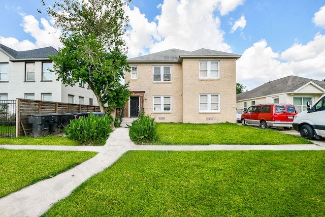 view of front of property with a front lawn