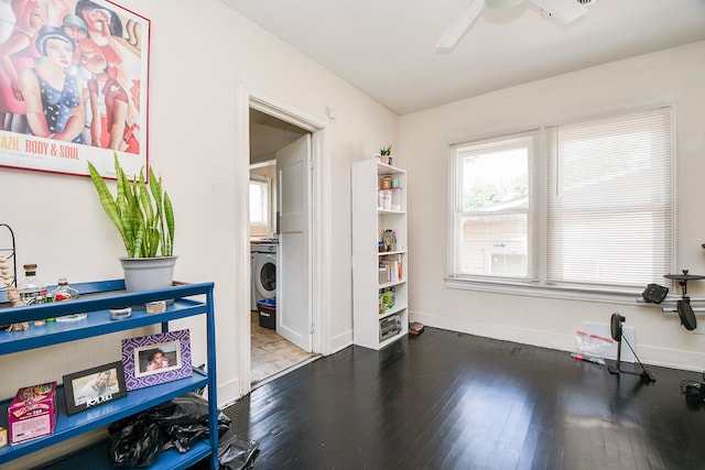 interior space with washer / dryer, hardwood / wood-style floors, and ceiling fan