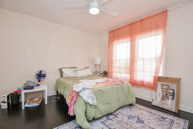 bedroom featuring dark wood-type flooring and ceiling fan