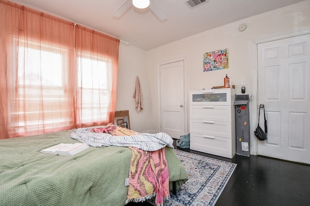 bedroom featuring ceiling fan and dark hardwood / wood-style flooring