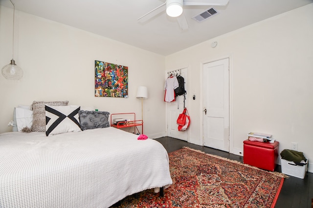 bedroom featuring ceiling fan and dark hardwood / wood-style floors