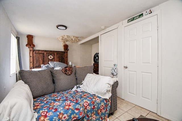 bedroom with light tile patterned flooring