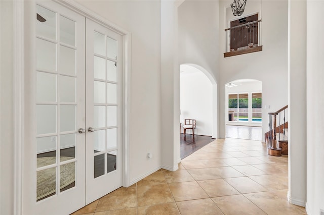 interior space featuring ceiling fan and french doors