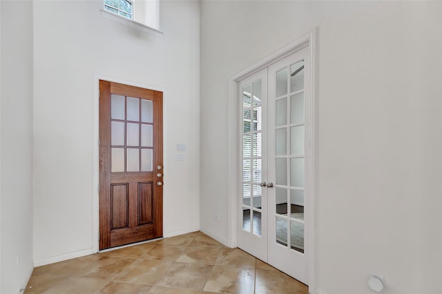 tiled foyer with french doors