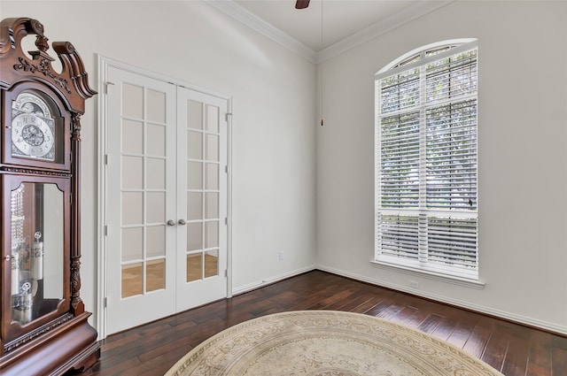 interior space featuring crown molding, ceiling fan, dark hardwood / wood-style floors, and french doors