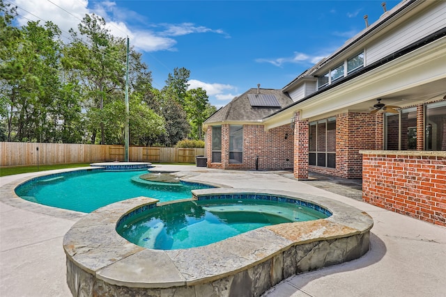 view of pool with an in ground hot tub, ceiling fan, and a patio