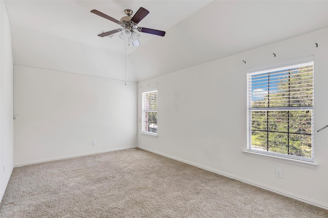 carpeted empty room with lofted ceiling and ceiling fan