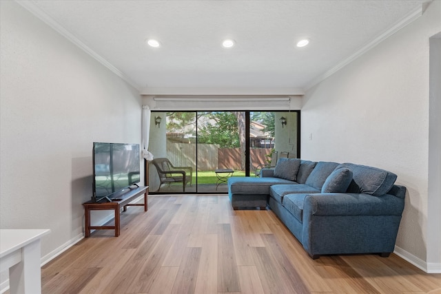 living room featuring ornamental molding and hardwood / wood-style flooring