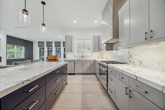 kitchen featuring gray cabinets, light tile patterned floors, and a wealth of natural light