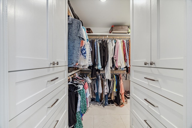 walk in closet featuring light tile patterned flooring