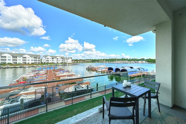 balcony featuring a water view