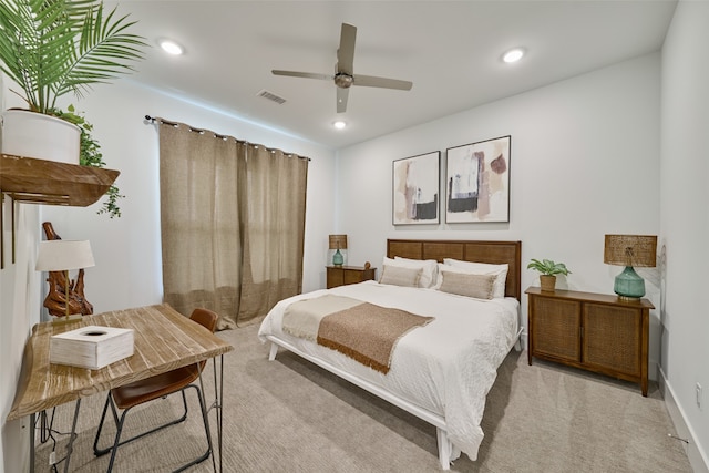 bedroom featuring light carpet and ceiling fan