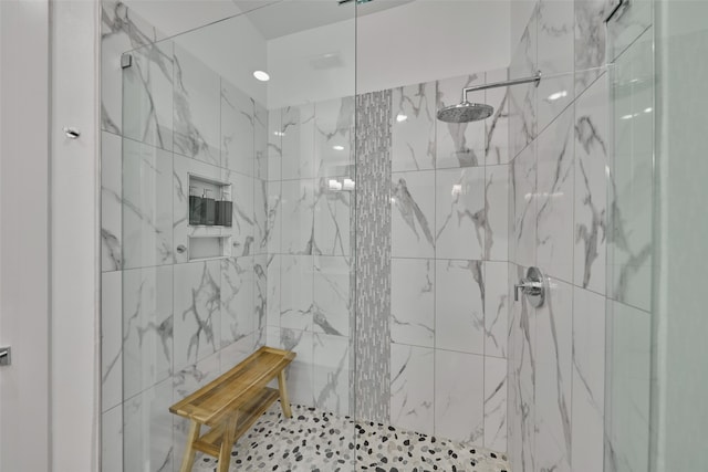 bathroom with tiled shower