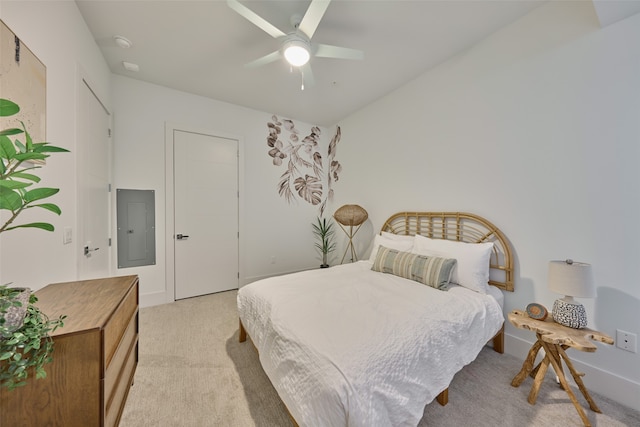 carpeted bedroom featuring electric panel and ceiling fan