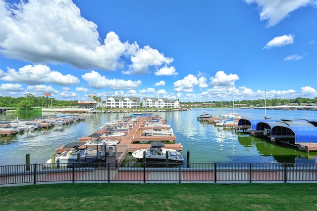 view of dock featuring a yard and a water view