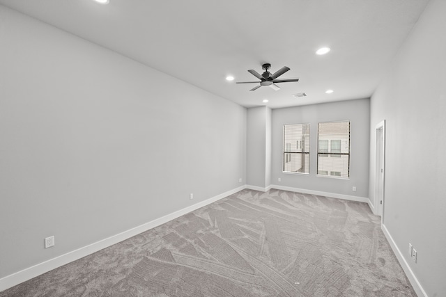 empty room with light carpet and ceiling fan