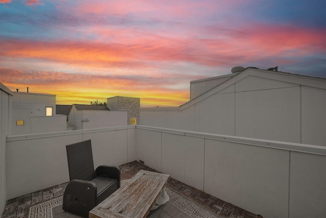 view of patio terrace at dusk