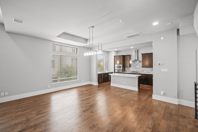 unfurnished living room featuring dark wood-type flooring