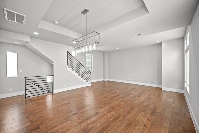 unfurnished living room with dark hardwood / wood-style floors