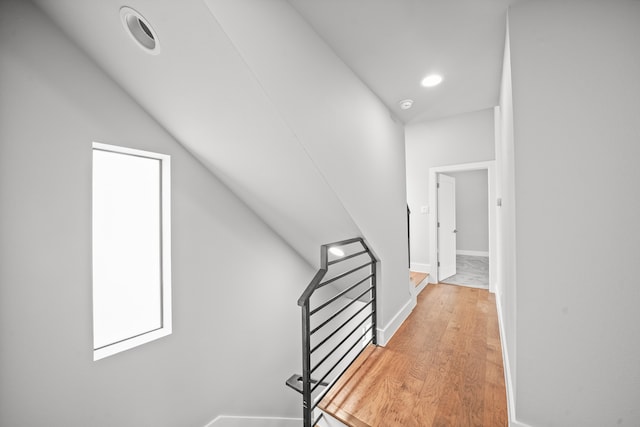 stairs with wood-type flooring