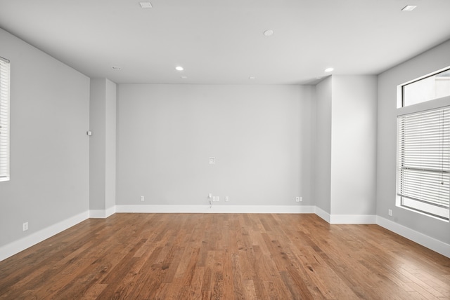 unfurnished room with light wood-type flooring