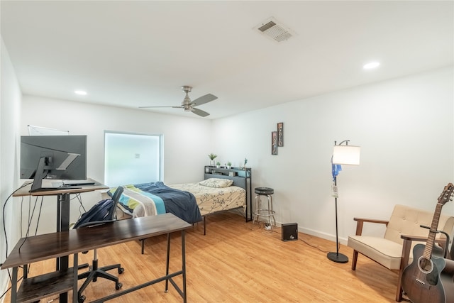 bedroom with light wood-type flooring and ceiling fan