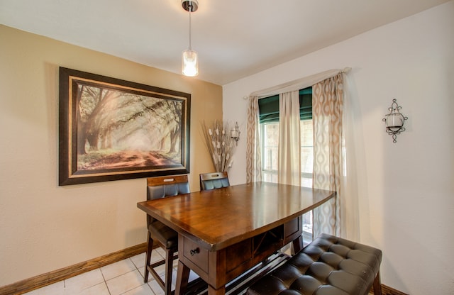 dining area featuring light tile patterned floors