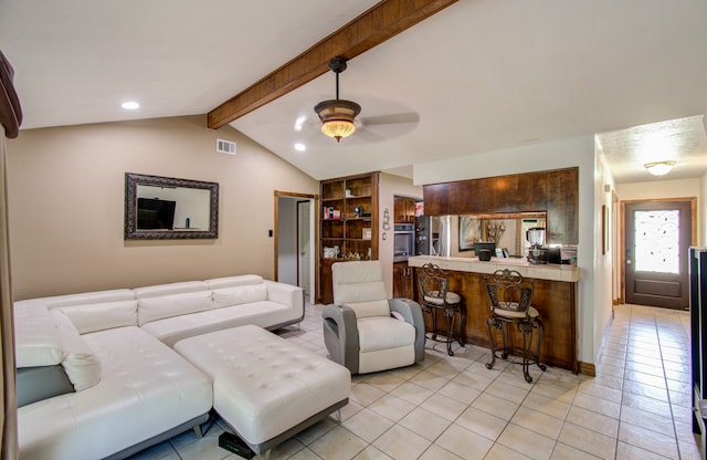 tiled living room with ceiling fan and lofted ceiling with beams