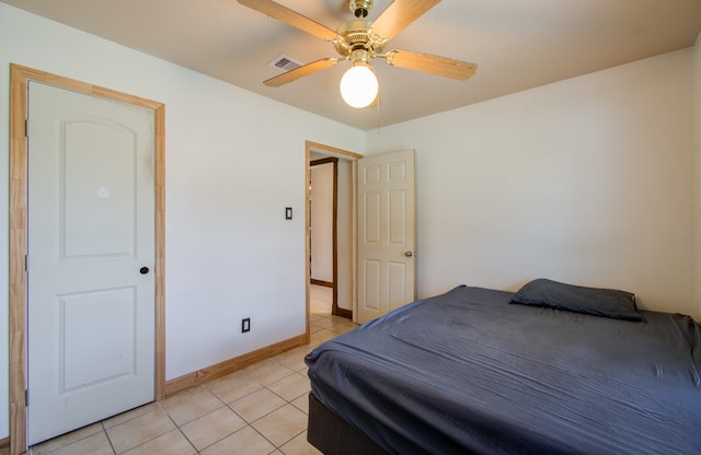 bedroom featuring light tile patterned floors and ceiling fan