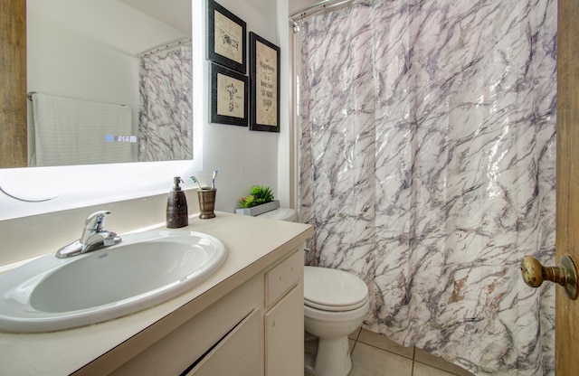 bathroom with vanity, tile patterned flooring, toilet, and a shower with curtain